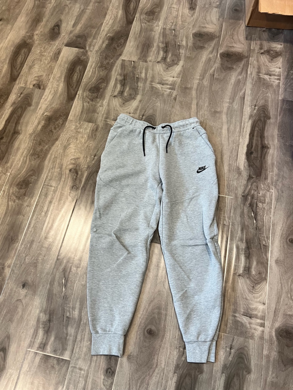 Nike men’s Light Gray Sweat Joggers with Black Swoosh